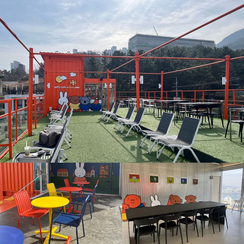 ooftop seating area with artificial turf and indoor cafe tables decorated with Miffy themes at the Yeongdo store in Busan.