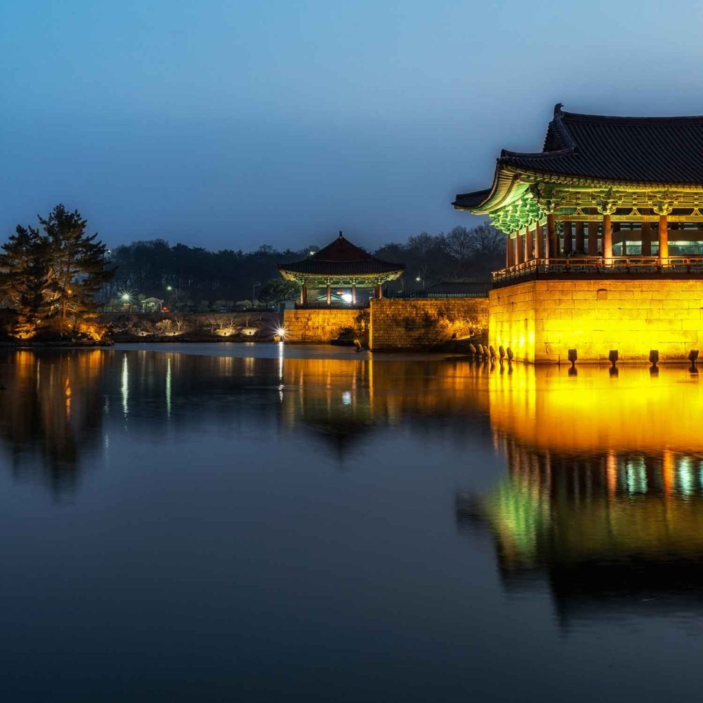 Ancient Cheomseongdae astronomical observatory during sunset in Gyeongju travel guide