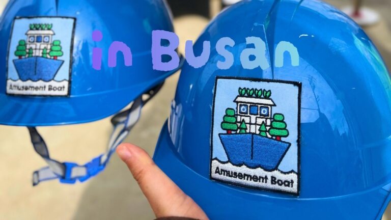 Blue safety helmets with amusement boat logos for the shipyard and floating ship experience at Busan Yeongdo Kangkangee Art Village, South Korea