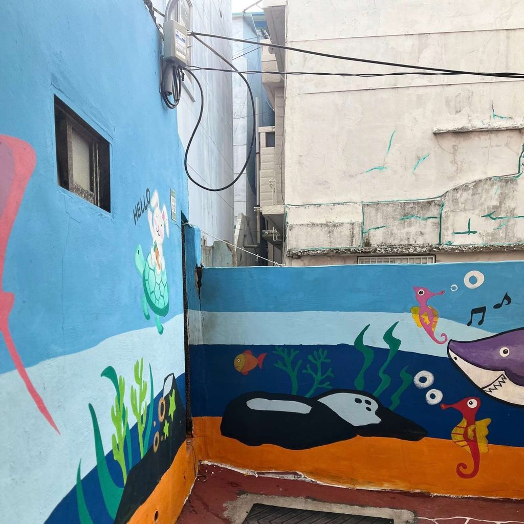 Colorful marine-themed mural paintings and public art along the alleyways of Busan Yeongdo Kangkangee Art Village.   